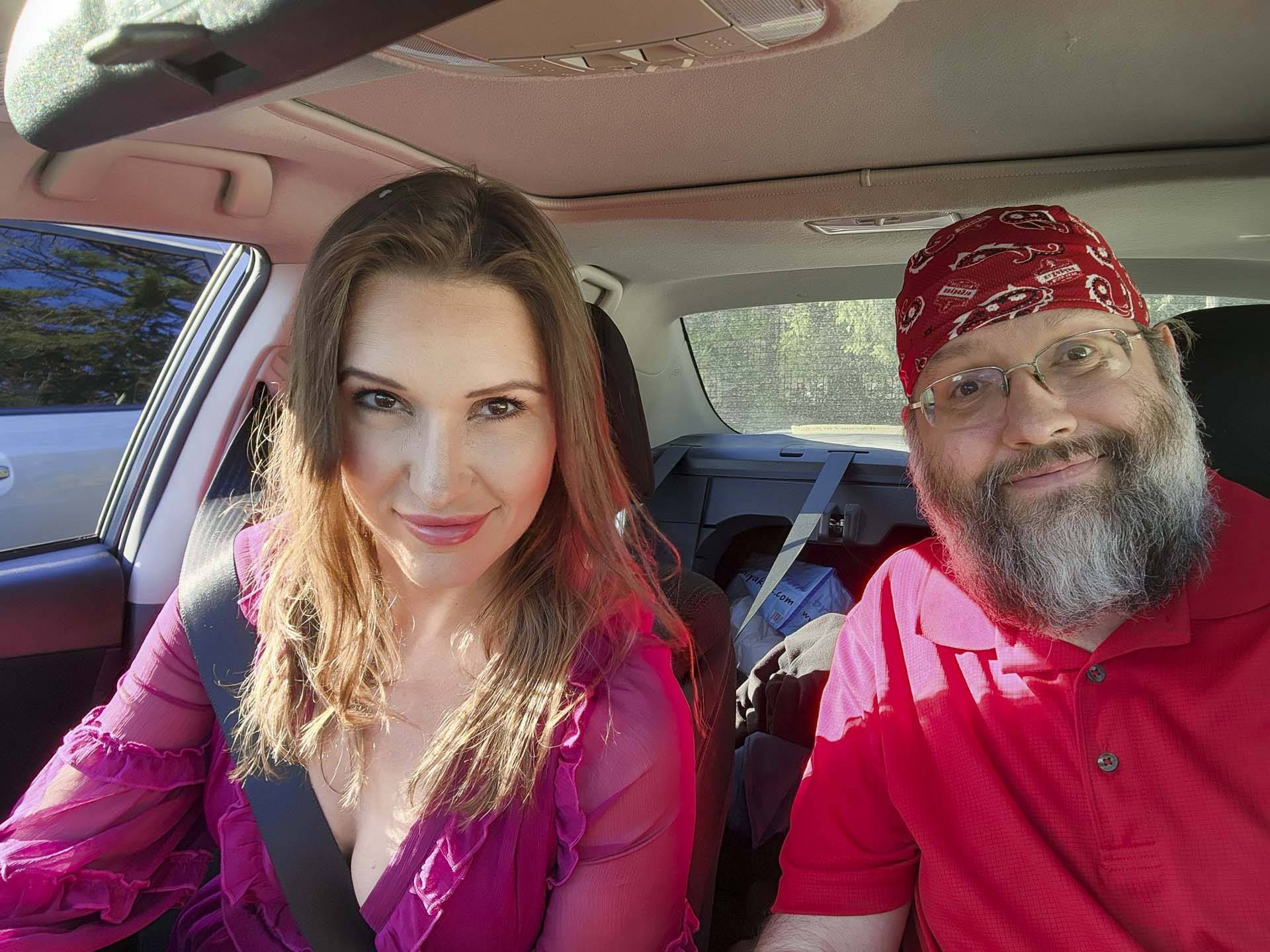 selfie of two people sitting in a car