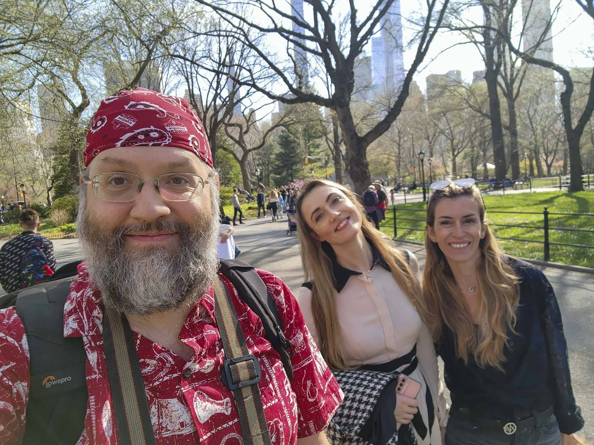 a selfie of three people in a park