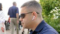Man wearing AirPods 3 in park